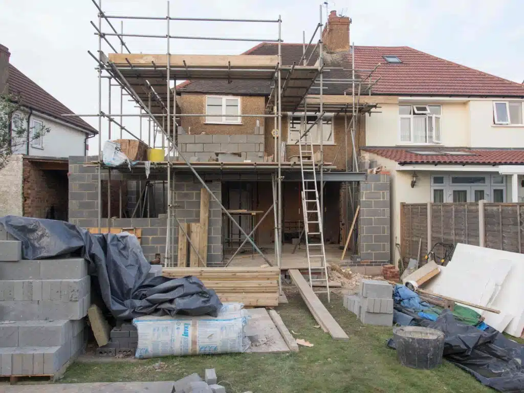 A building being extended on the first floor with DAJA London Extensions Builders.